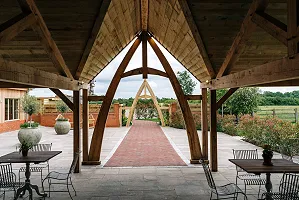 Looking out of the carriage barn towards the arches