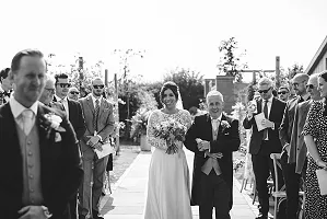 Bride and father walking down the aisle