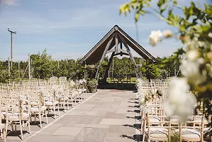 Chairs awaiting guests in front of the summer house